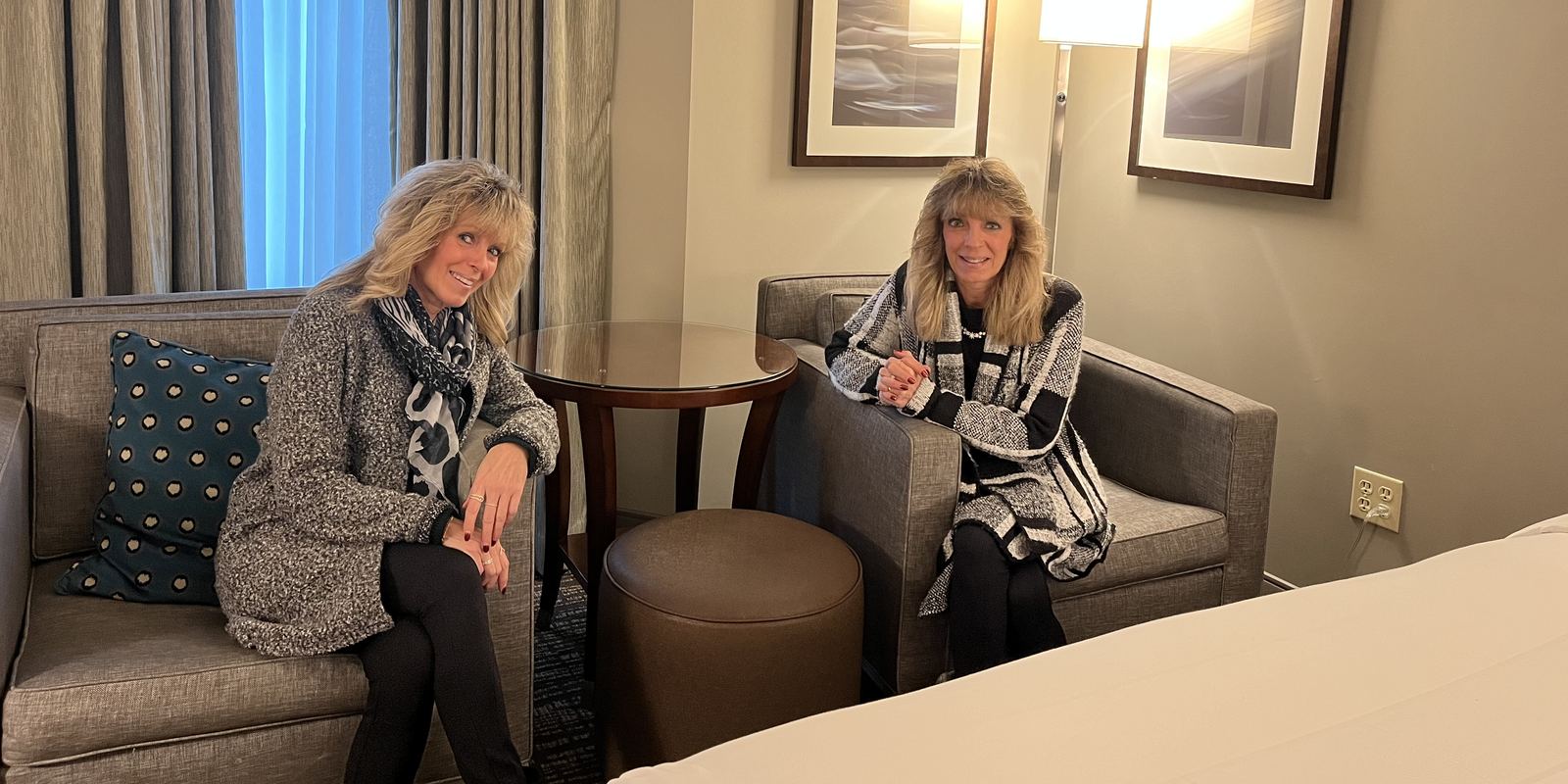 Two adult identical twin sisters side by side