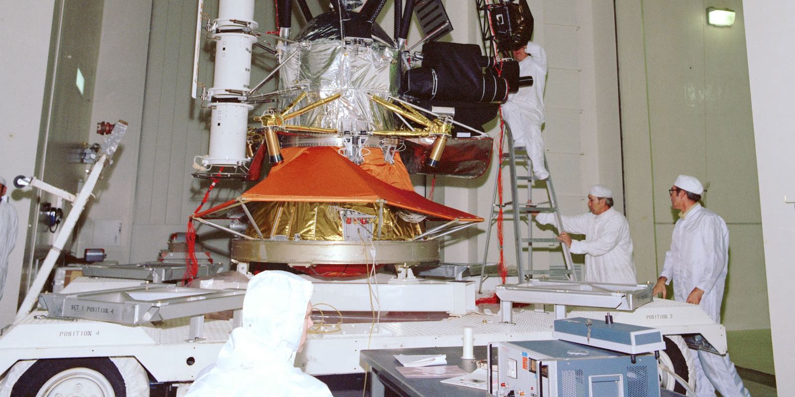 Engineers testing a Voyager spacecraft at NASA's Jet Propulsion Laboratory
